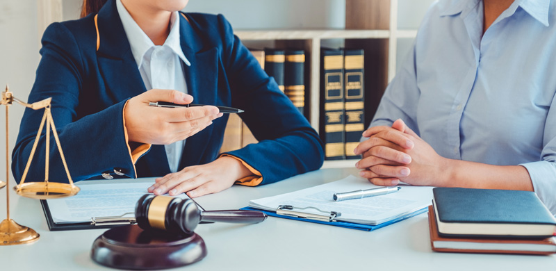 Personal Injury lawyer seated at a desk.  